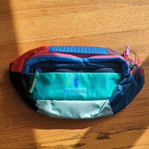 Cotopaxi Blue and Red Belt Bag Vibrant Design